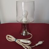 Table lamp, chrome glass stand and transparent glass globe.