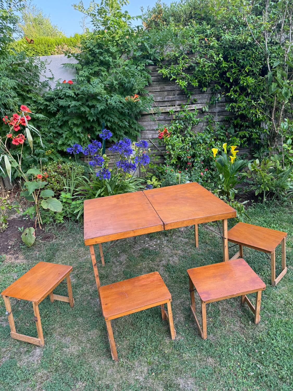 Old suitcase, table and stools, vintage wooden picnic