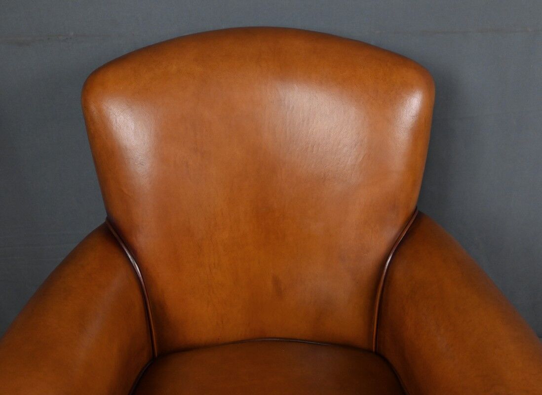 Paire de fauteuils club en cuir