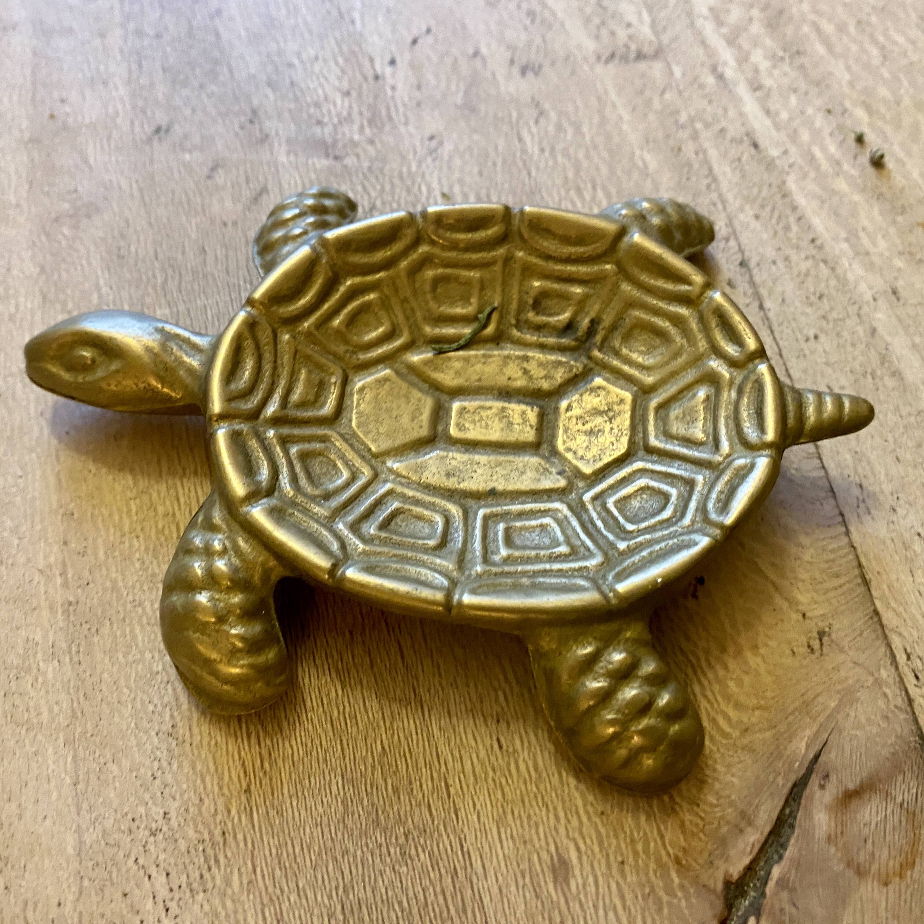 Vintage brass turtle pocket emptier