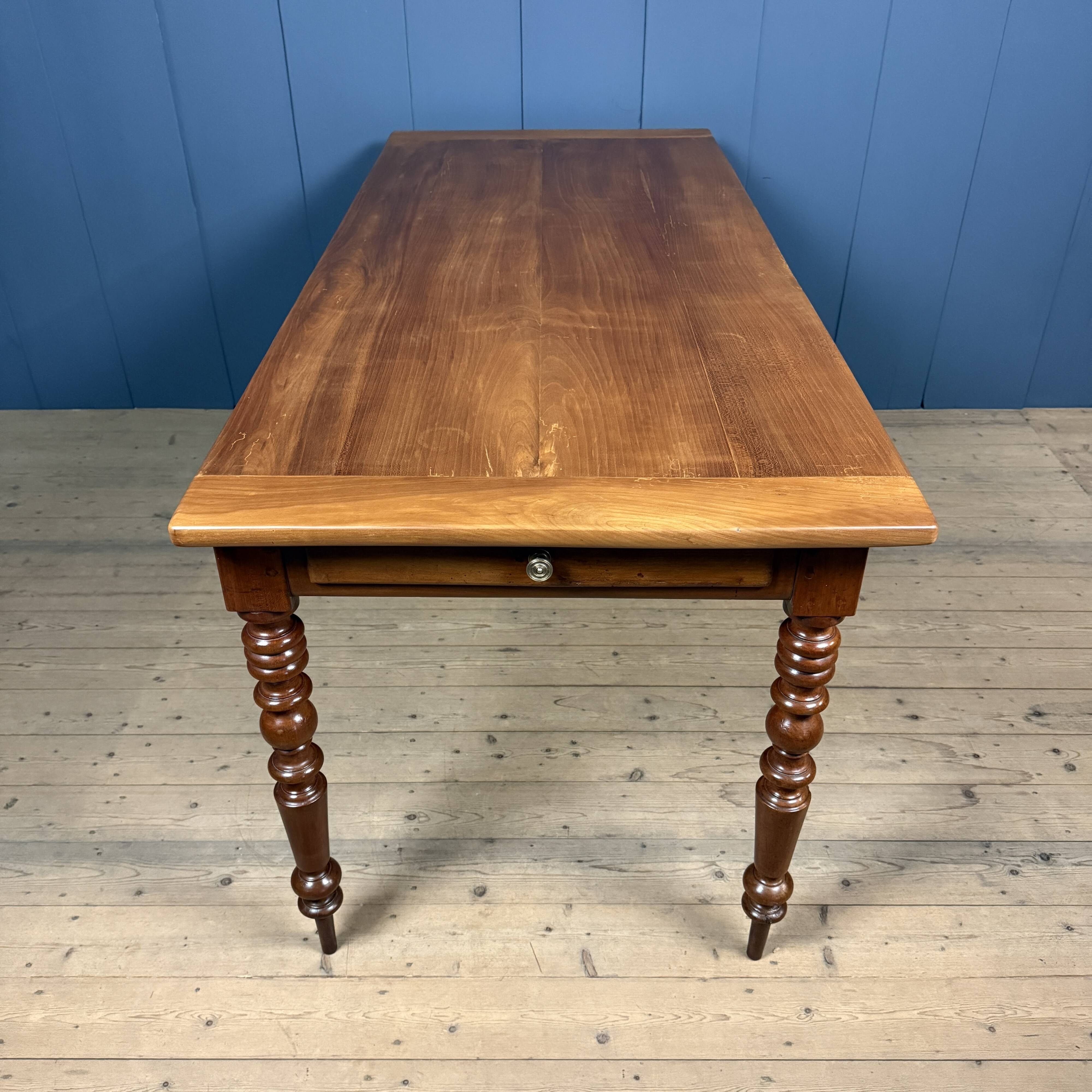 Antique cherry wood dining table from France.