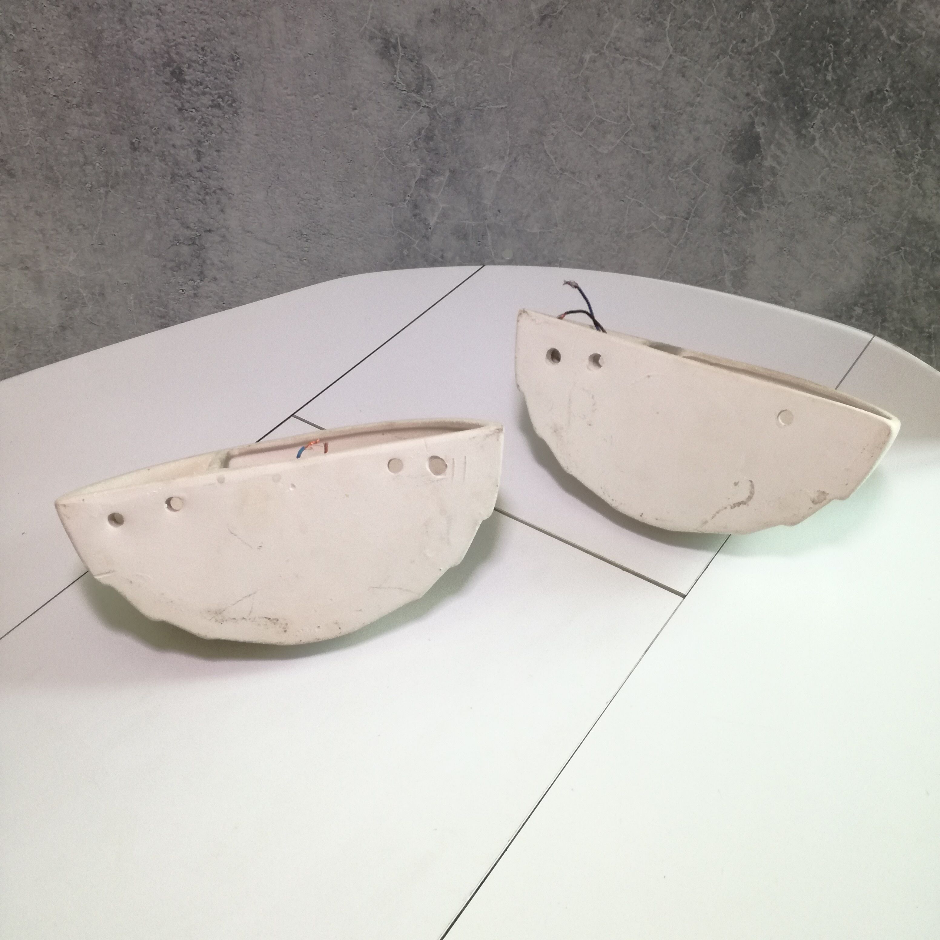 Wall sconces in stone and in the shape of a basin