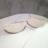 Wall sconces in stone and in the shape of a basin