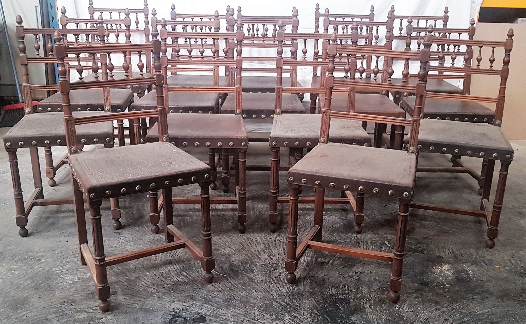 A set of 16 henri 2 style chairs in repelled leather 2 patterns