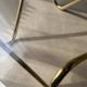 Coffee table with smoked glass and curved metal base