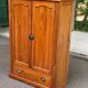 Small wardrobe / bonnetière in solid honey pine with 2 doors and 1 drawer.