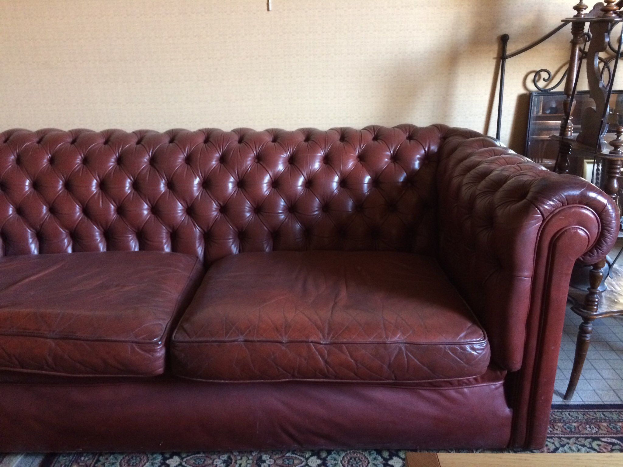Old red leather Chesterfield sofa