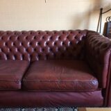 Old red leather Chesterfield sofa