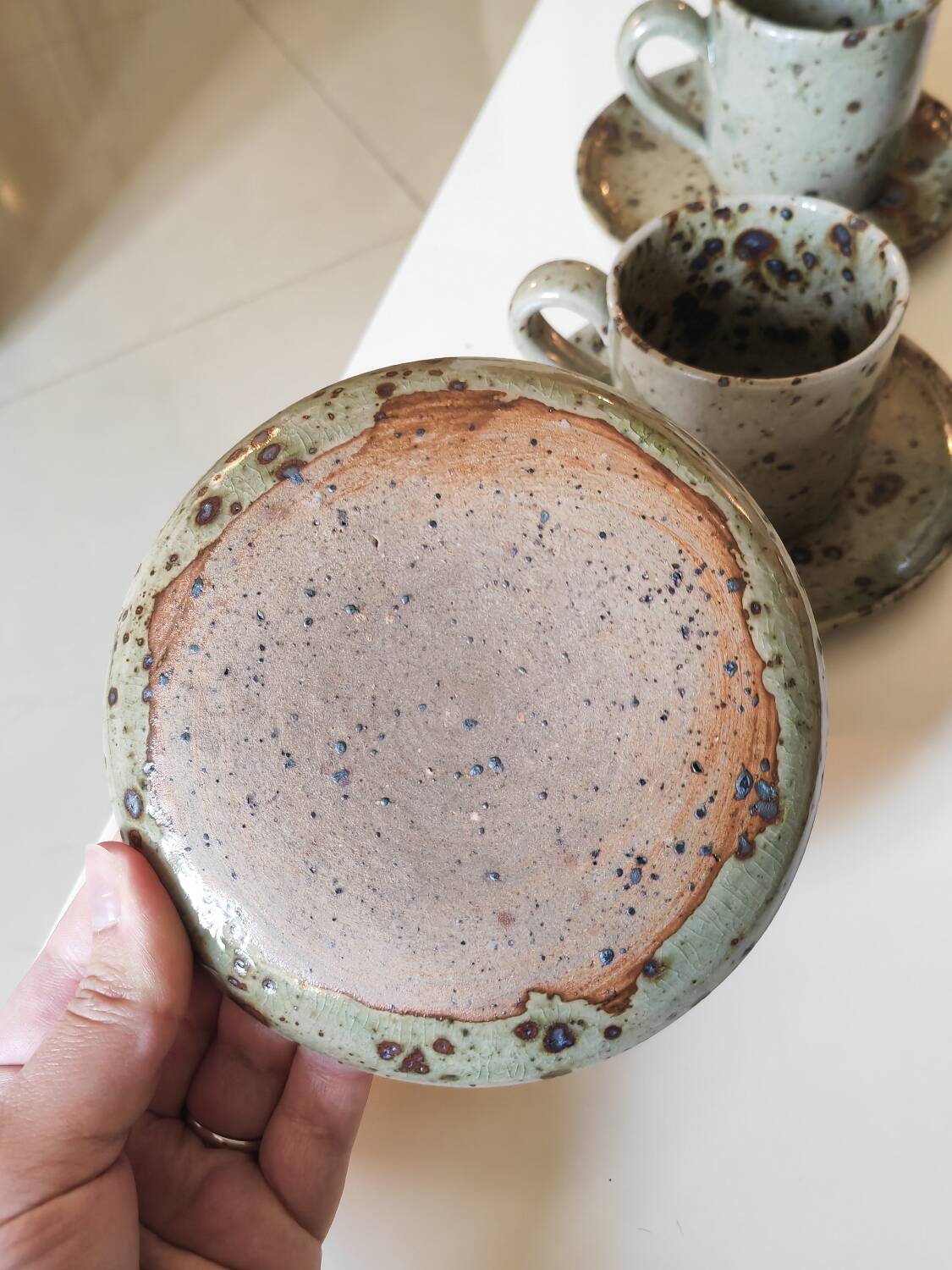 Series of stoneware cups and saucers