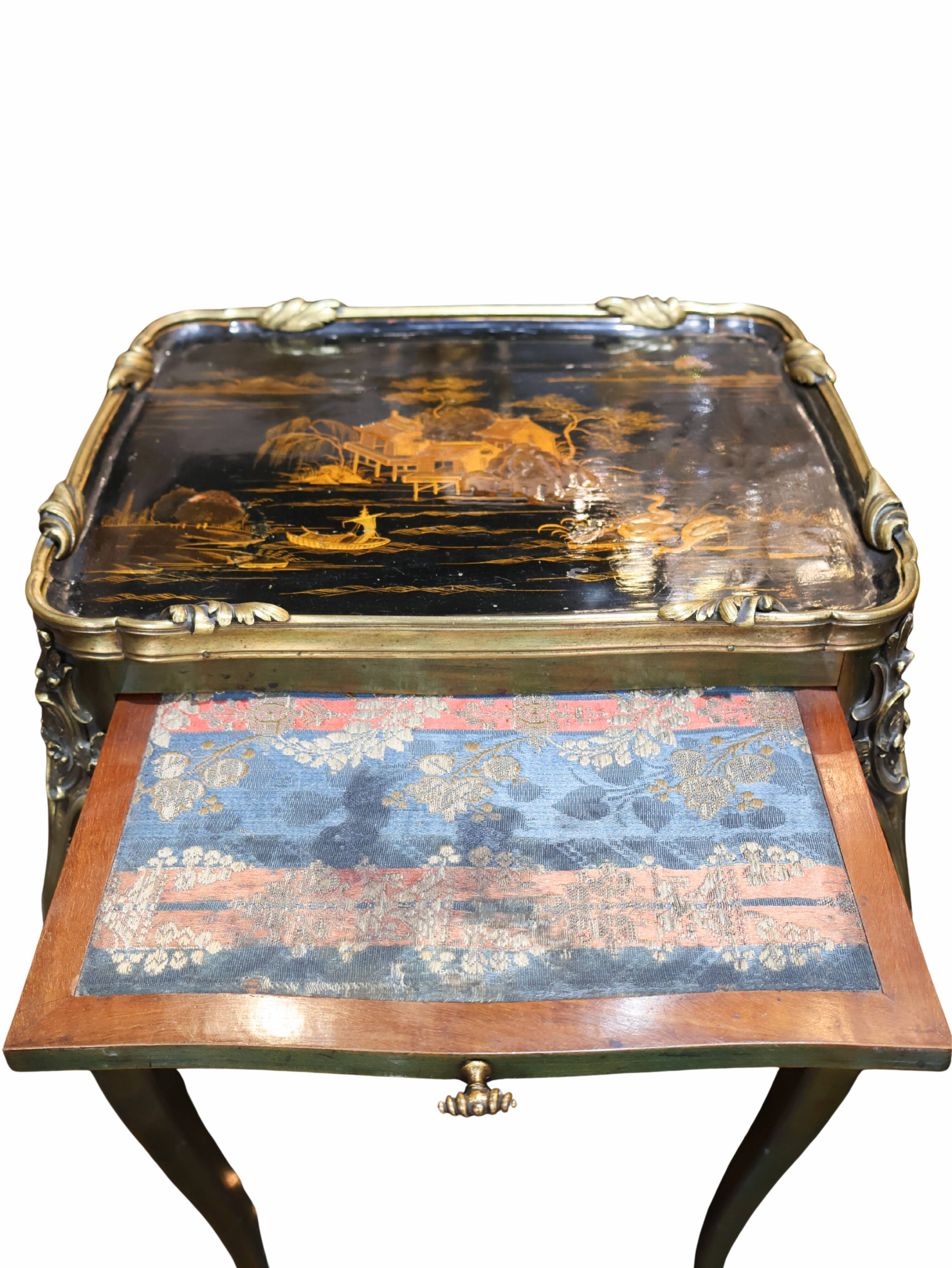 Japanese-style work table from the Napoléon III period in black lacquer and gilded bronze.