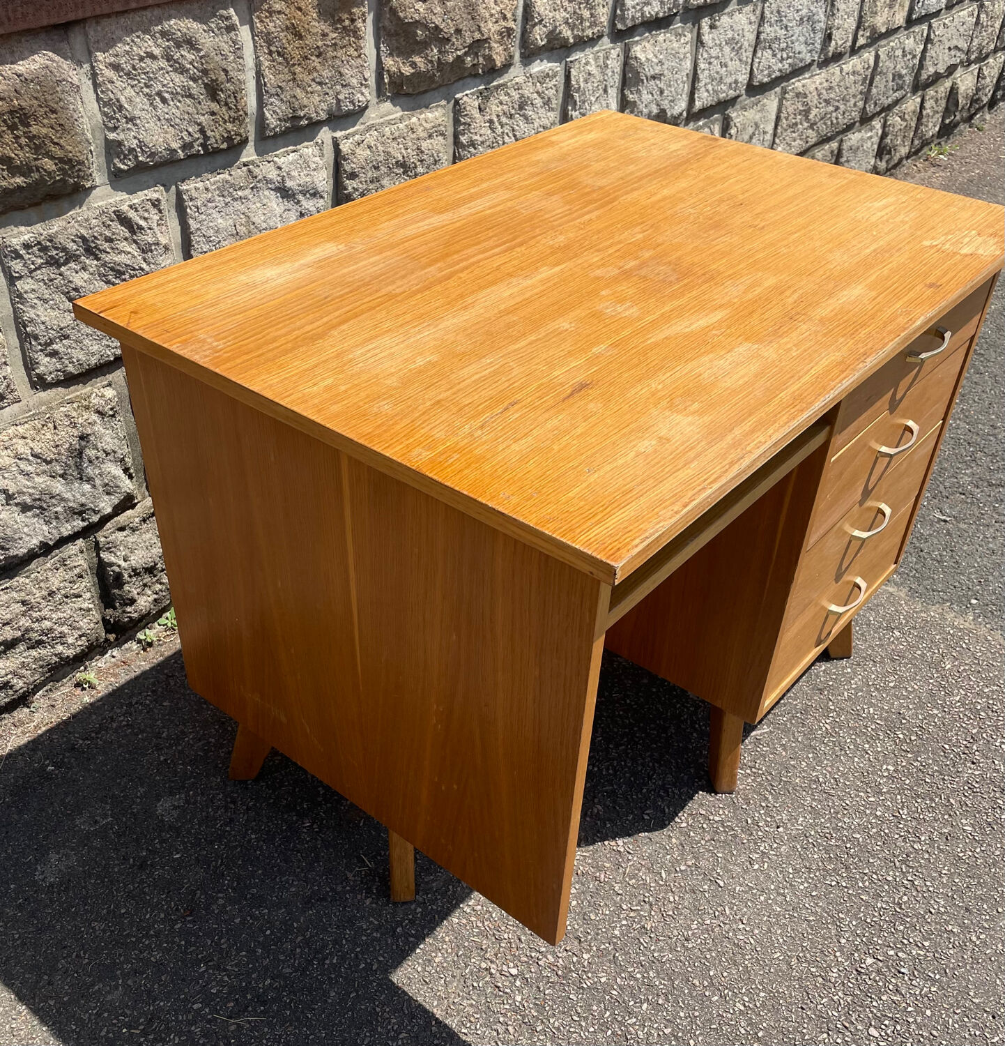 Double-sided desk with compass legs.
