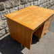 Double-sided desk with compass legs