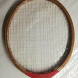 Red ribbon wooden badminton racket