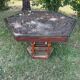 Handcrafted hexagonal wooden table with natural decor.
