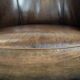 Set of two sheepskin club armchairs with fixed seat cushions