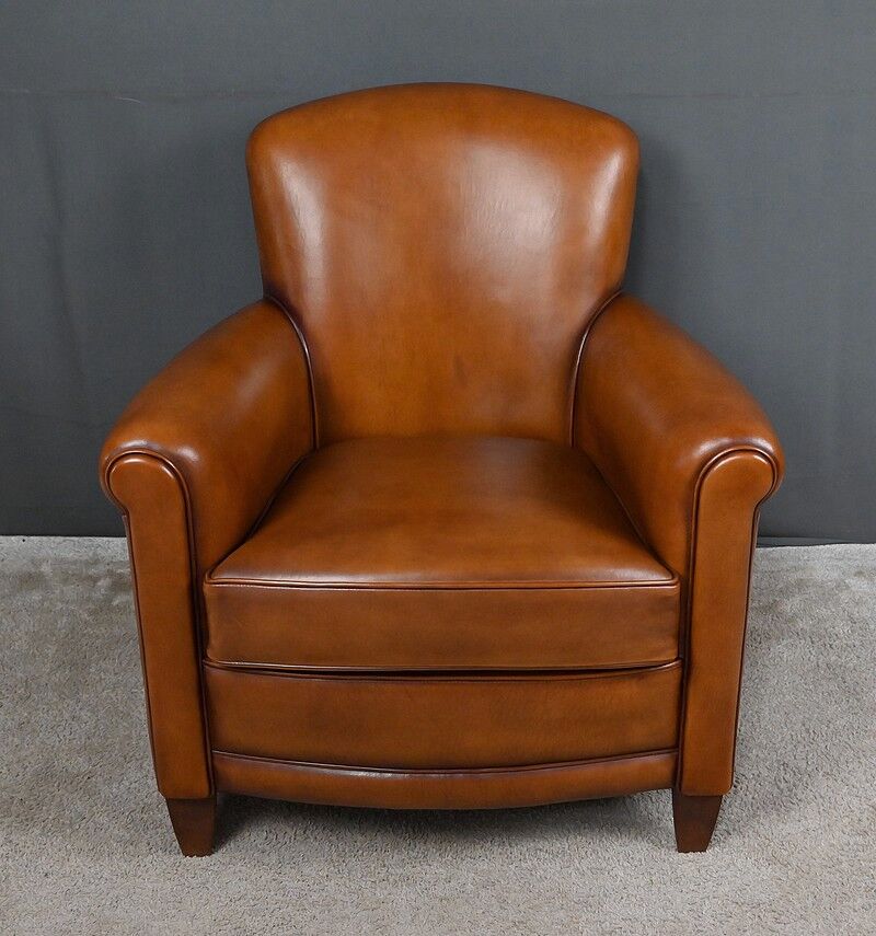 Paire de fauteuils club en cuir