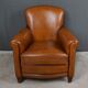 Paire de fauteuils club en cuir