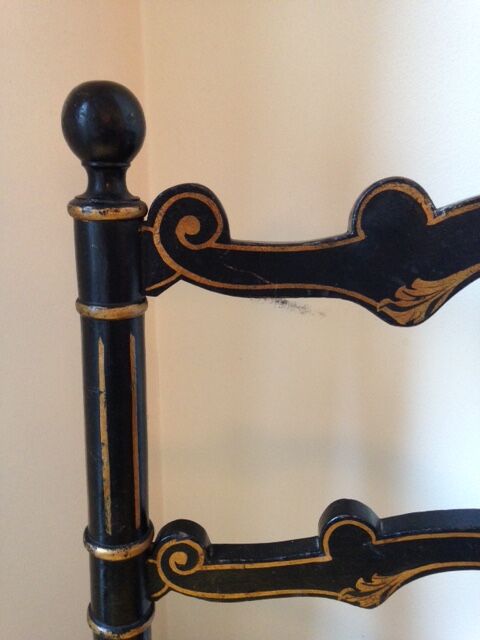 Pair of black and gold chairs