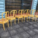 6 yellow canned chairs