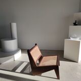 Reclined armchair in canned teak in natural wood