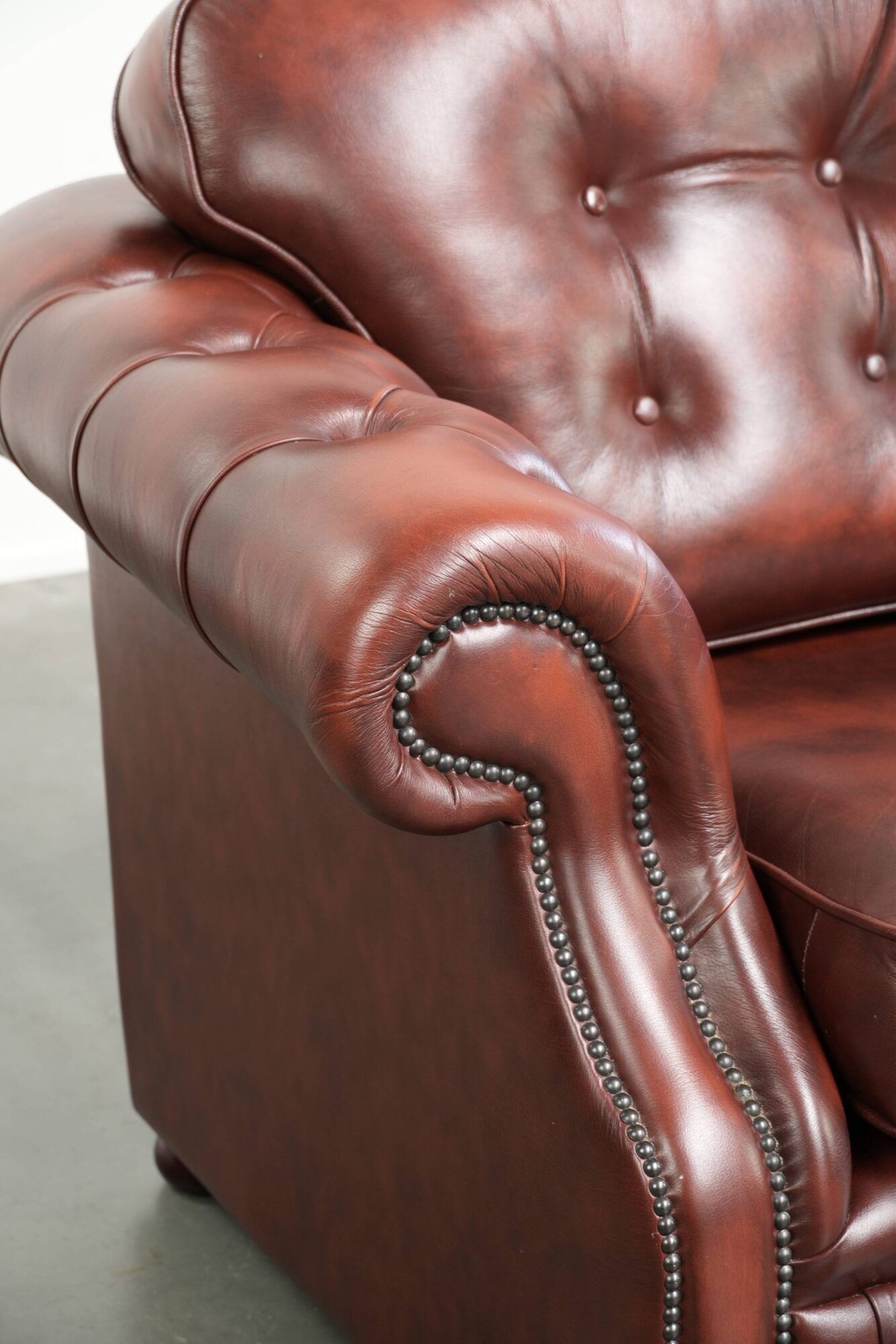 Vintage set of 2 cowhide leather Chesterfield armchairs in a brown colour