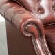 Vintage set of 2 cowhide leather Chesterfield armchairs in a brown colour