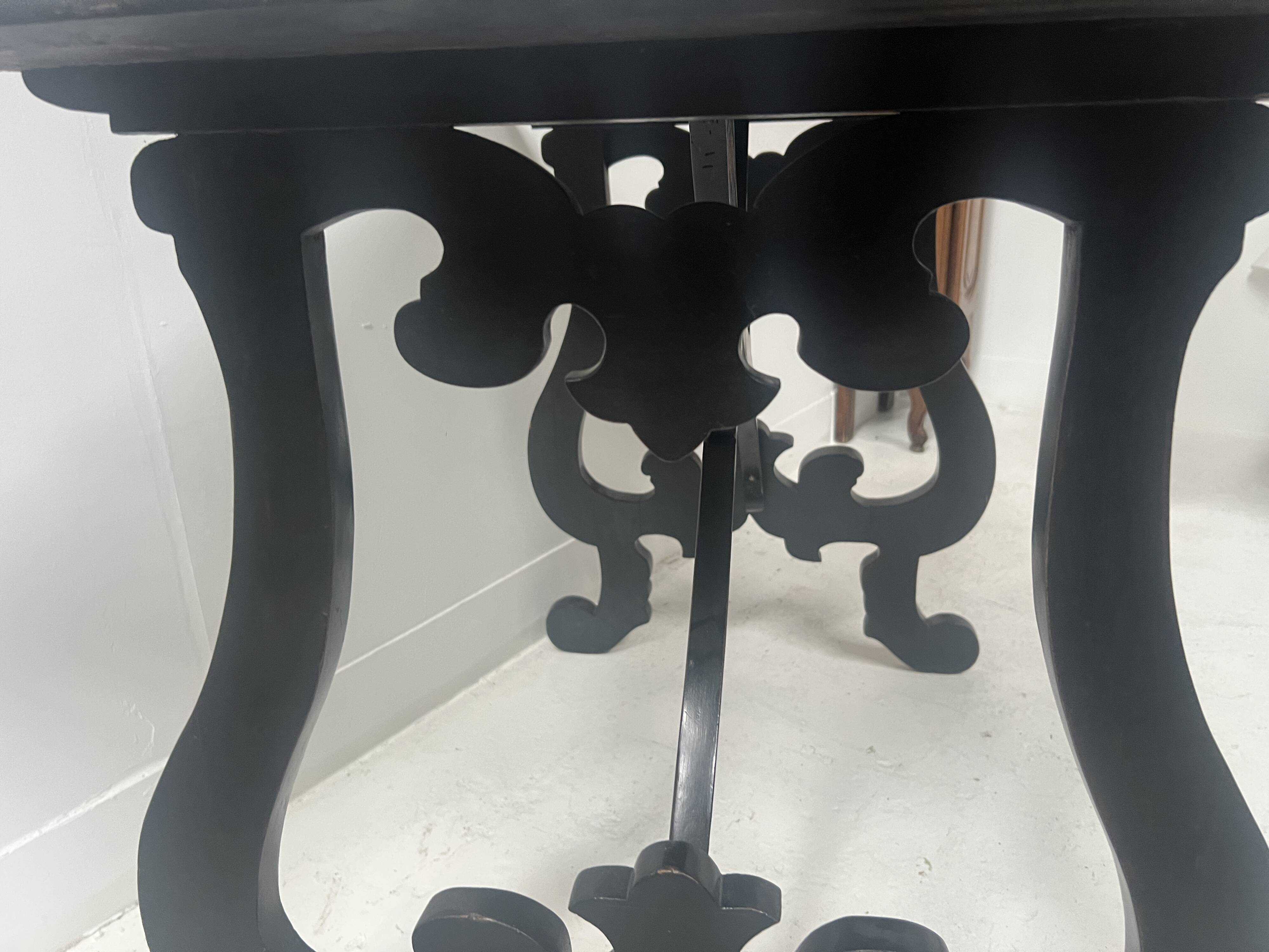 Blackened wood display table with marquetry top, Spain, 19th century.