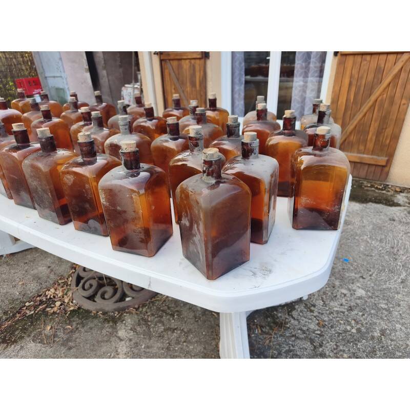 Set of 41 brown glass pharmacy bottles.