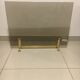 Fireplace screen in smoked glass and brass