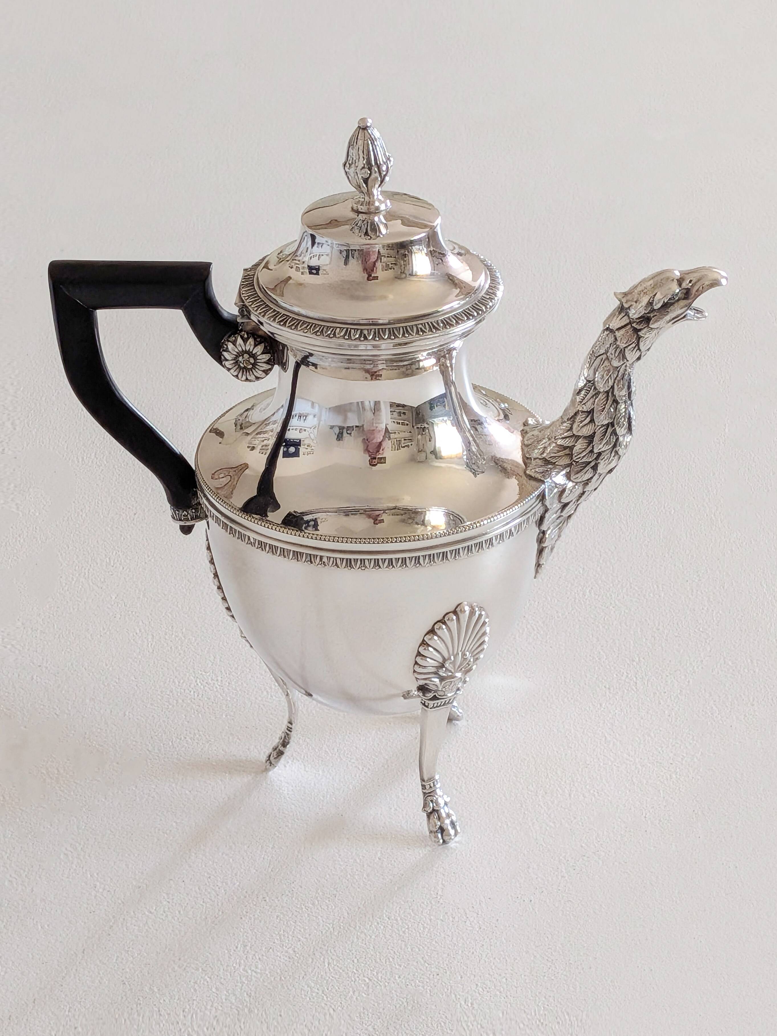 Empire-style silver-plated coffee pot with eagle head spout.