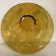 Yellow glass cup with a floral pattern