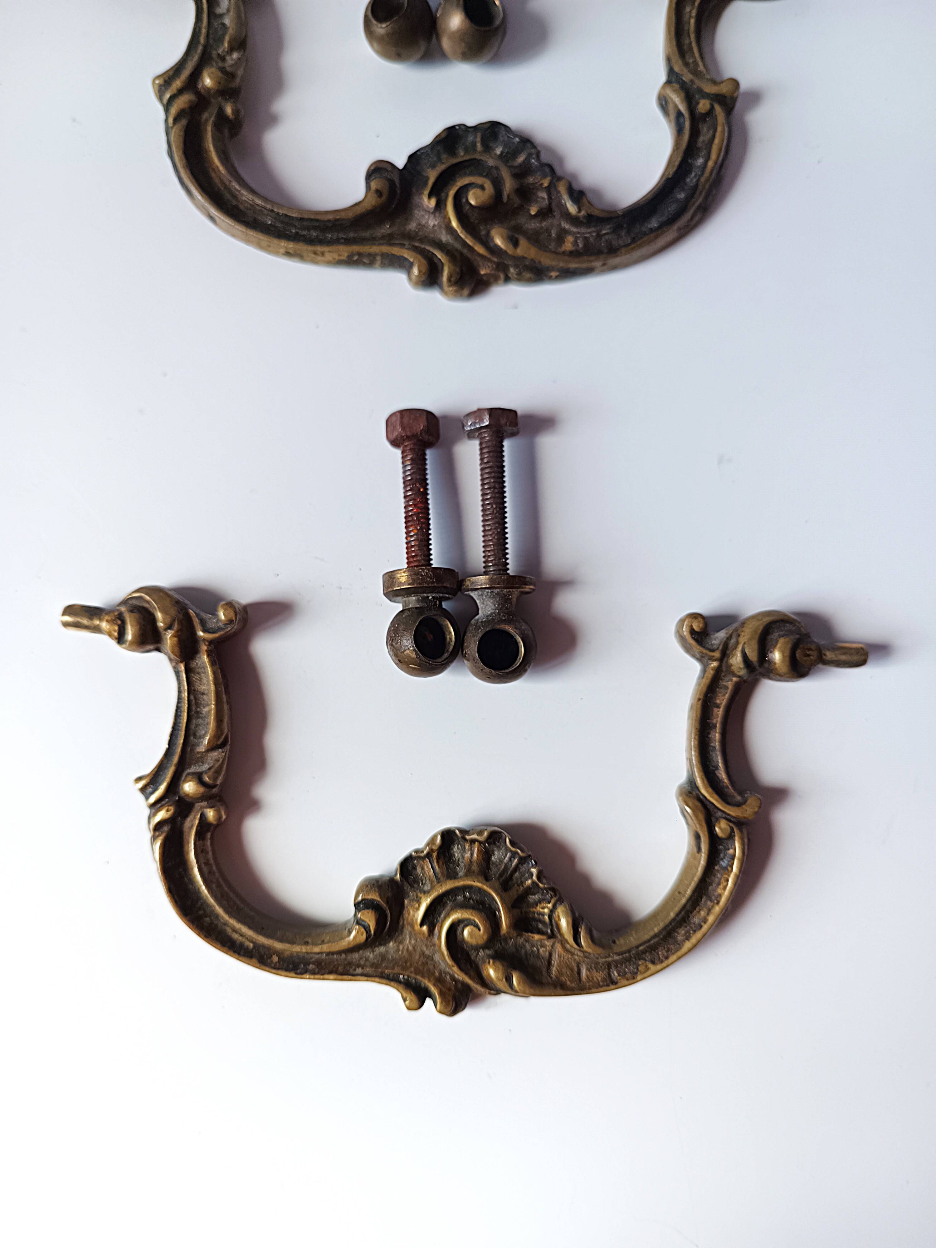 Antique pair of bronze drawer handles.