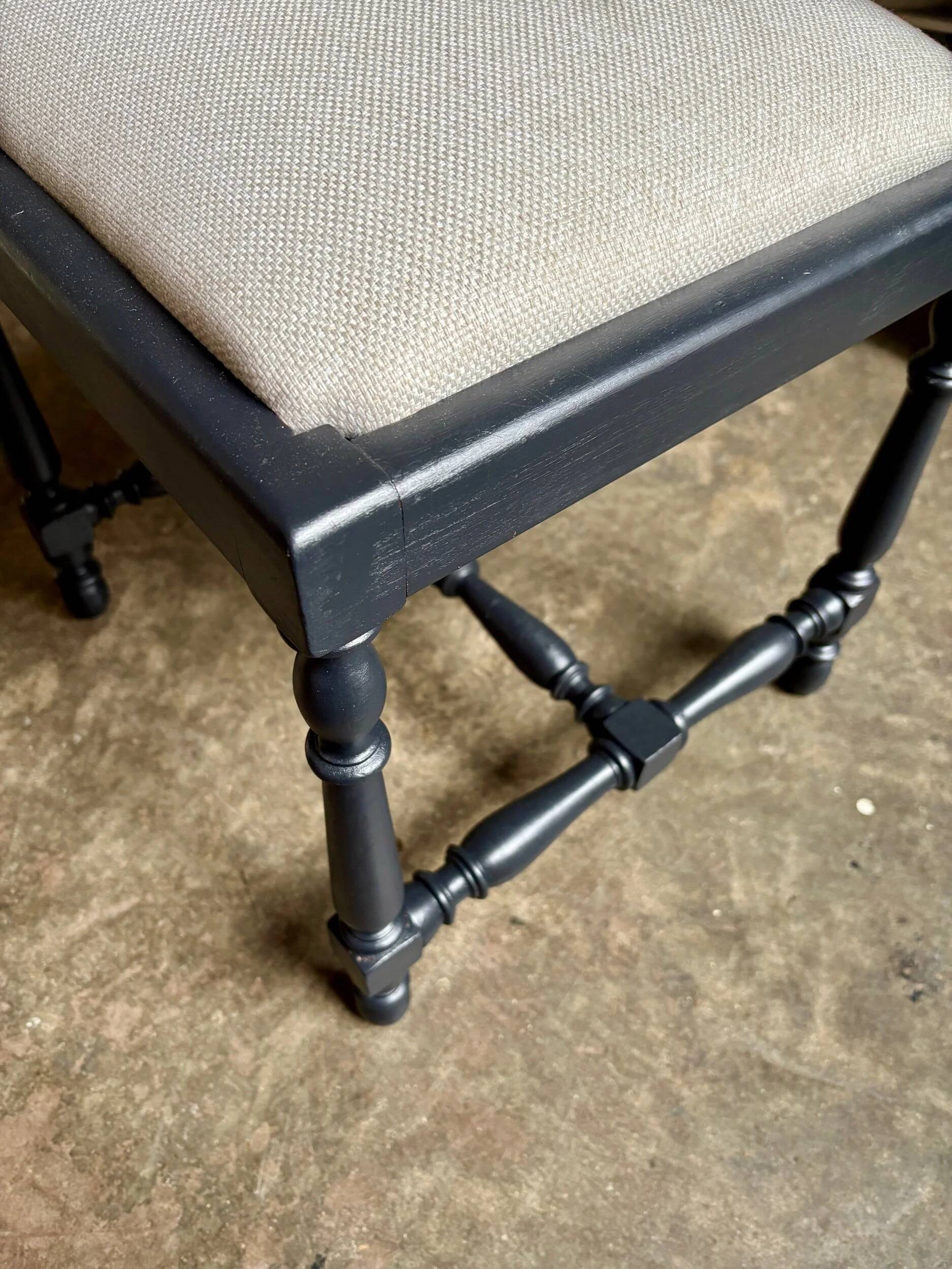 Black turned wooden chair and ivory cotton.