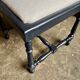 Black turned wooden chair and ivory cotton.
