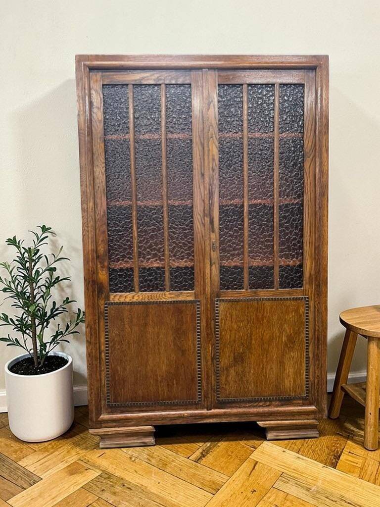 Vintage wooden display cabinet with textured glass.
