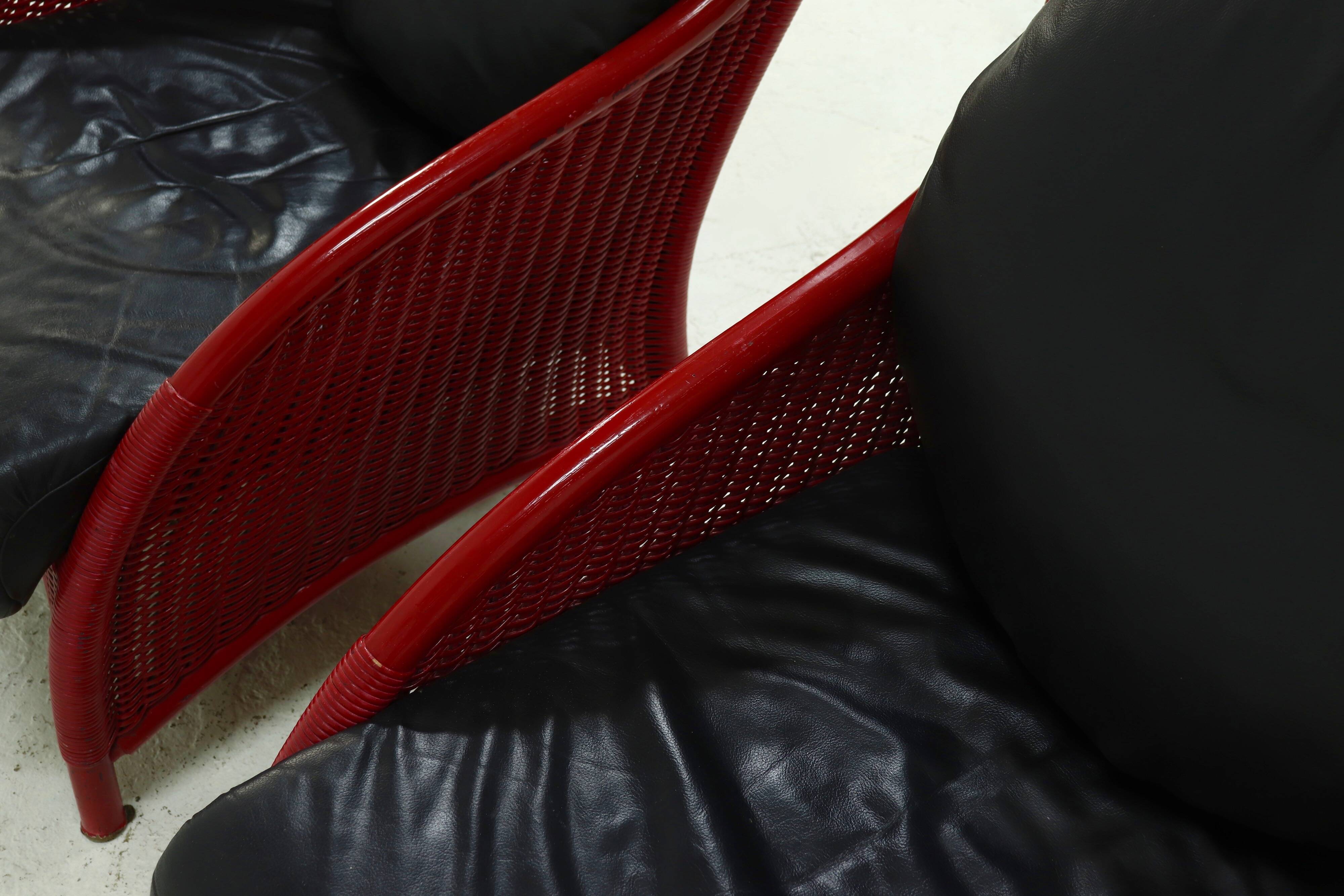 Set of 2 Sculptural Lounge Chairs in Red Lacquered Rattan 1970s
