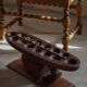 Decorative Mancala game board made of hand-carved wood, Africa, mid-20th century.