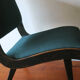 Jens Risom armless chair with ebonized frame and petrol blue-green covers