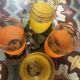 Four glasses in orange granités in orange and yellow