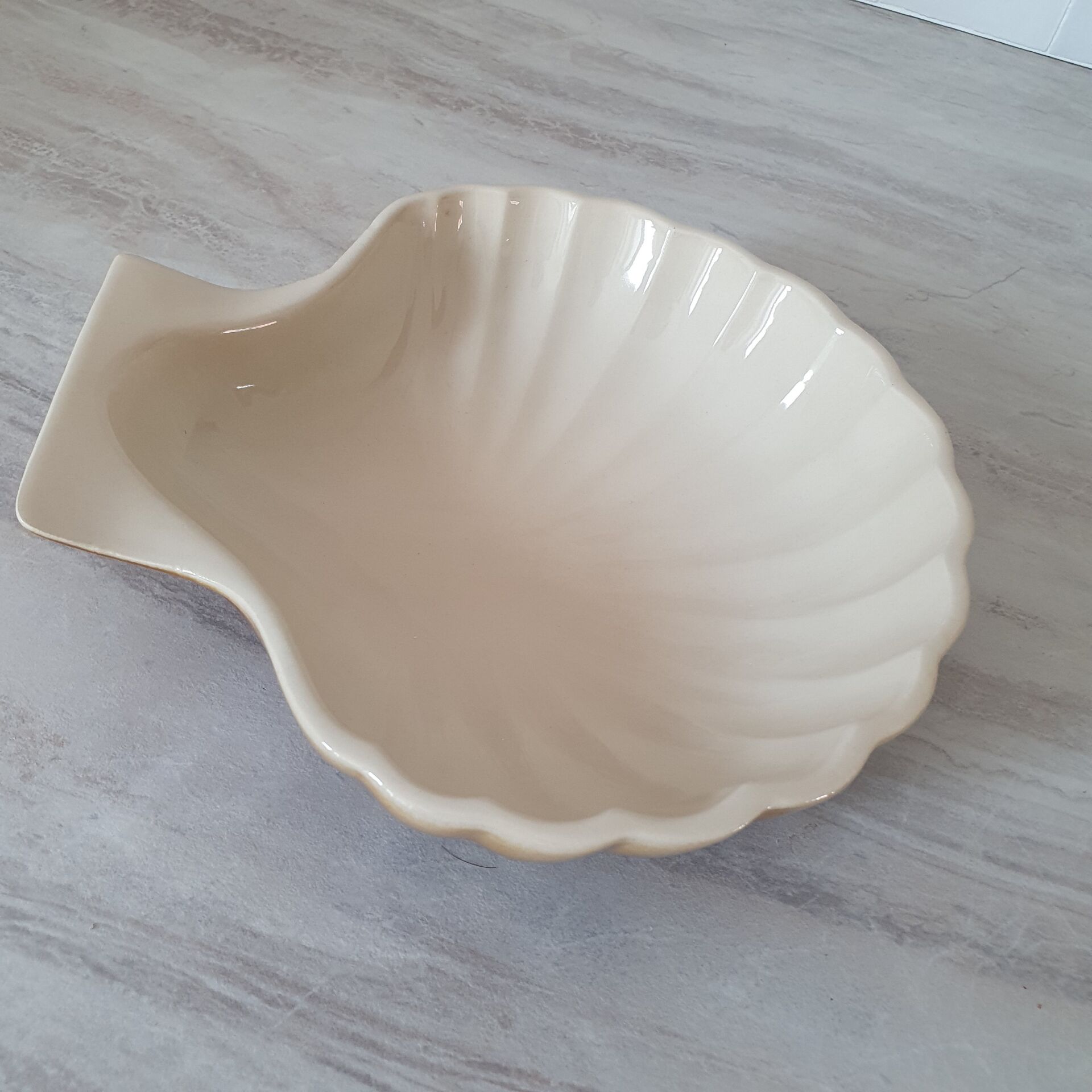 Brown and white ceramic shell bowl