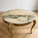 Baroque style coffee table with marble and gilded wood.