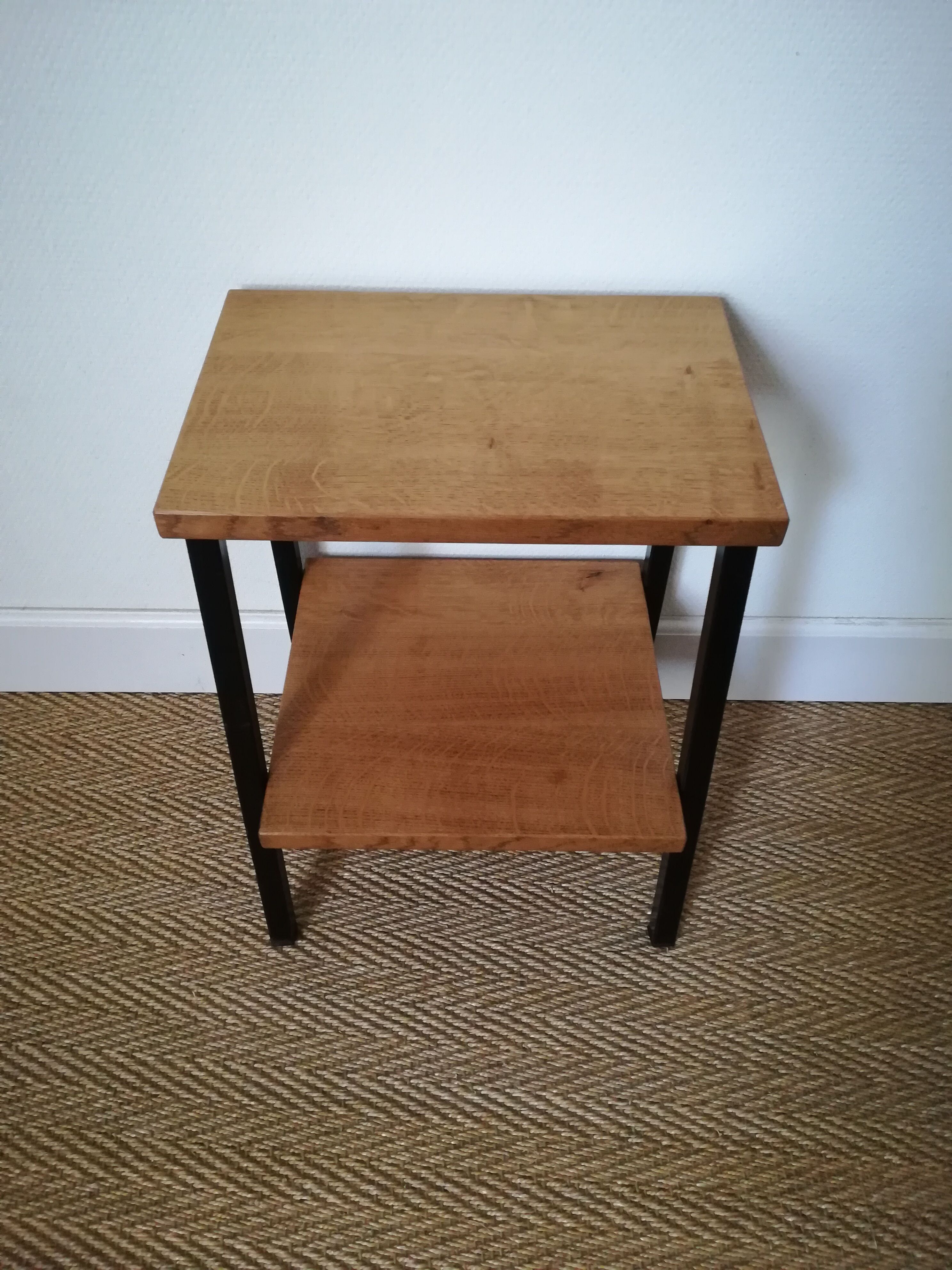 A pair of bedside tables