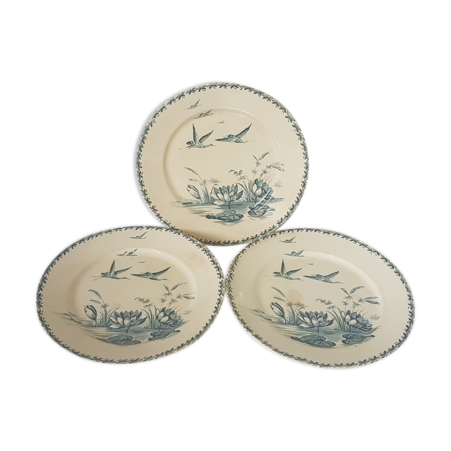 3 flat plates made of Badonviller earthenware model Nenuphar, iron earth