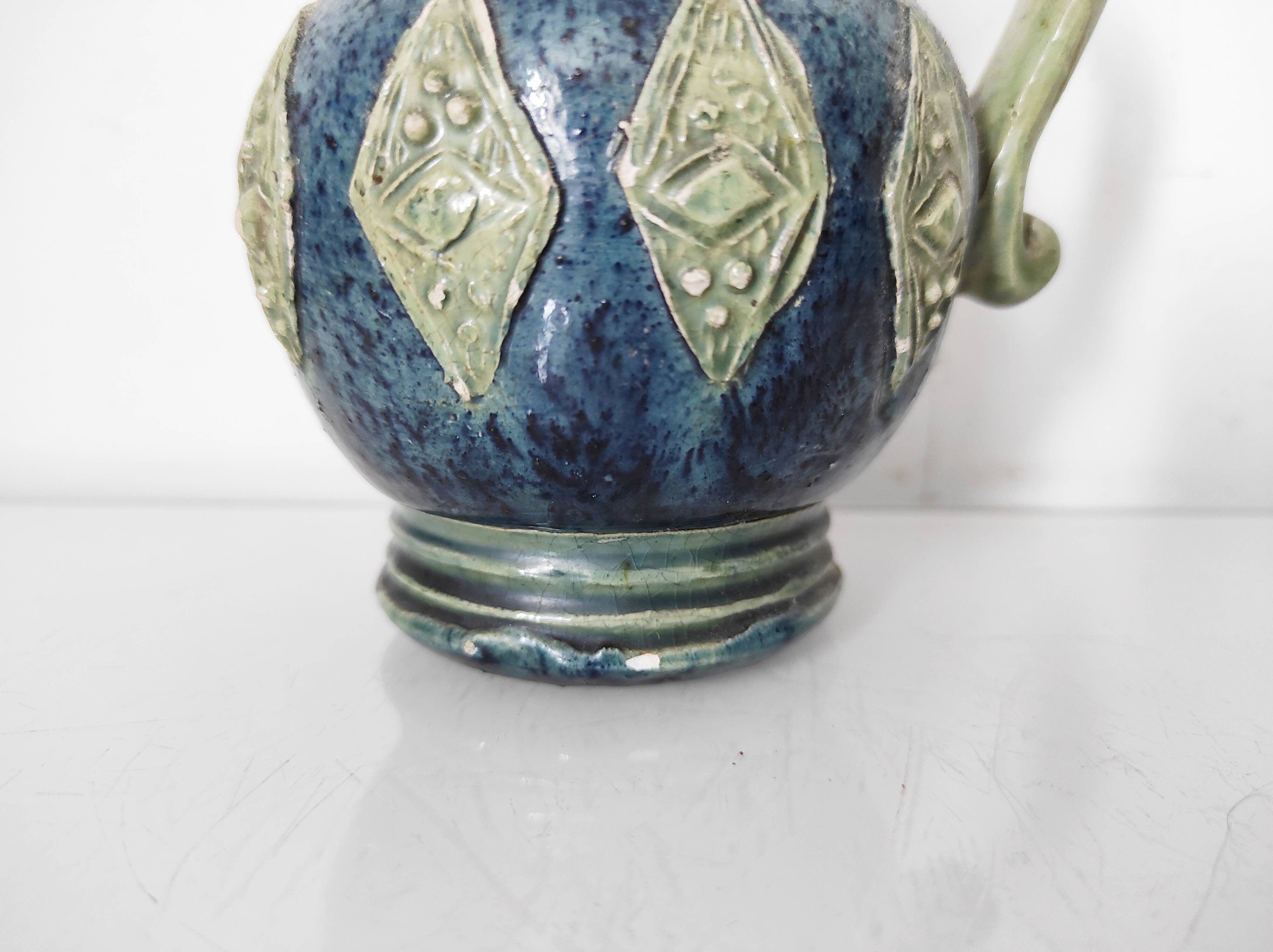 Two small blue ceramic vases