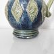 Two small blue ceramic vases