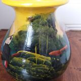 Mexican popular art vase decorated with parrots and toucans.