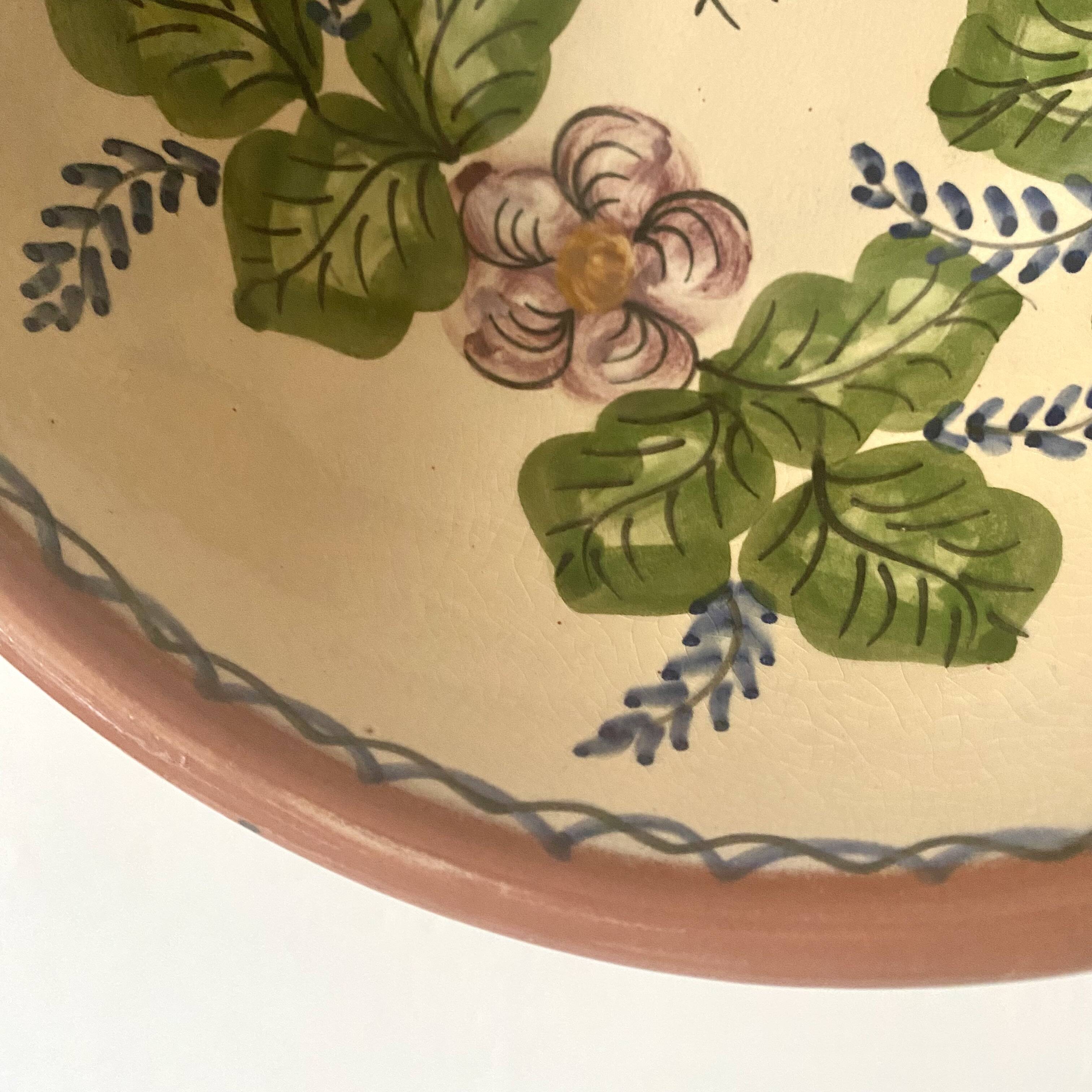 Terracotta salad bowl with flower decoration