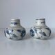 Pair of miniature blue and white Vietnamese ceramic vases with floral decoration.
