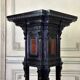 A pedestal table in blackened wood and burl veneer, superb assembly of moldings circa 1880