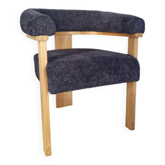 Contemporary armchair in wood and bouclé fabric
